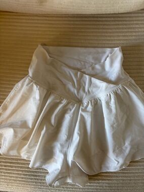 White High-Waist Ruffle Shorts. Built in compression shorts with pockets.